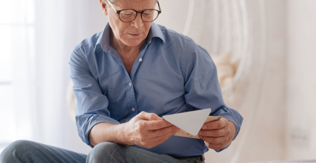 Old Man Reading Letter