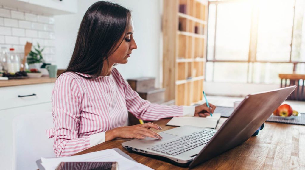 Women Calculating Taking Notes