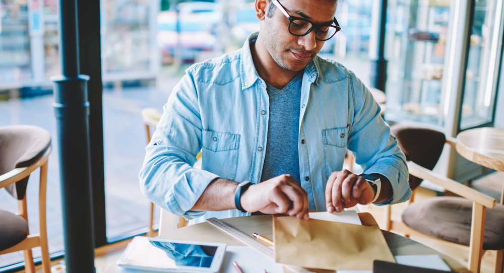 Canadian man admires direct mail design that includes a free sample